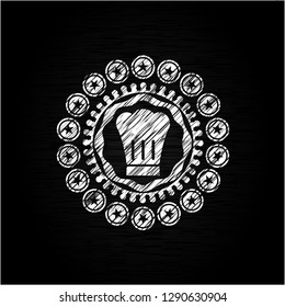 chef hat icon inside chalkboard emblem written on a blackboard