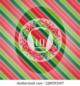 chef hat icon inside christmas colors badge.