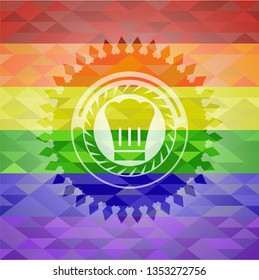 chef hat icon inside emblem on mosaic background with the colors of the LGBT flag