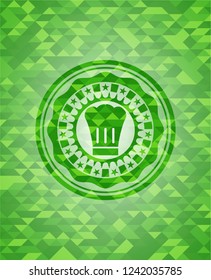 chef hat icon inside green mosaic emblem