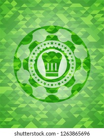 chef hat icon inside green emblem with mosaic background