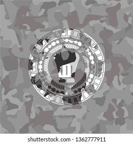 chef hat icon inside grey camouflage texture