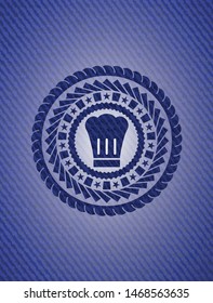 chef hat icon inside jean or denim emblem or badge background