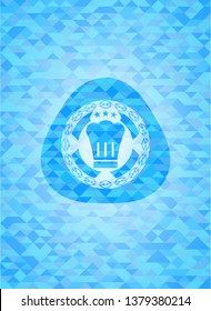 chef hat icon inside light blue emblem with triangle mosaic background