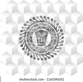 chef hat icon inside realistic grey emblem with geometric cube white background