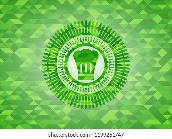 chef hat icon inside realistic green mosaic emblem