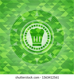 chef hat icon inside realistic green emblem. Mosaic background