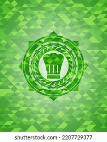 icono de sombrero de chef dentro del emblema de mosaico verde realista. 