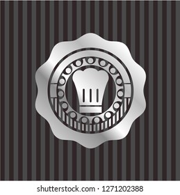 chef hat icon inside silvery badge or emblem