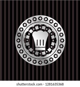 chef hat icon inside silvery badge or emblem