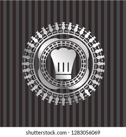 chef hat icon inside silvery emblem