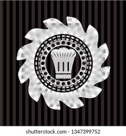 chef hat icon inside silvery badge or emblem