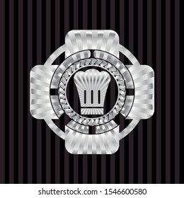 chef hat icon inside silvery badge or emblem