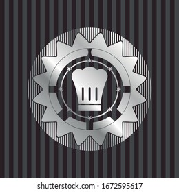 chef hat icon inside silvery emblem