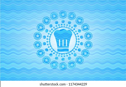 chef hat icon inside sky blue water style emblem.