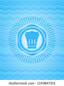 chef hat icon inside sky blue water style badge.