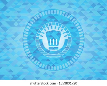 chef hat icon inside sky blue mosaic emblem