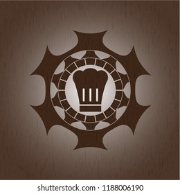 chef hat icon inside vintage wooden emblem