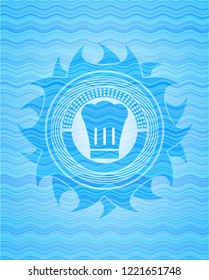 chef hat icon inside water wave concept badge.