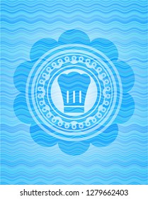 chef hat icon inside water concept style badge.
