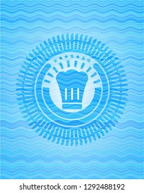 chef hat icon inside water wave style emblem.