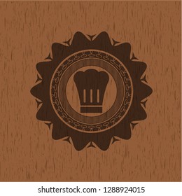 chef hat icon inside wooden emblem