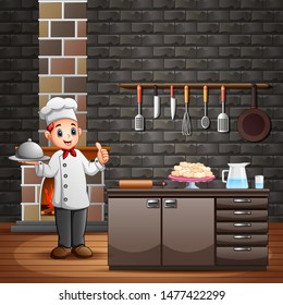 Chef holding a silver plate of food in the kitchen