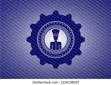 chef icon inside badge with denim background