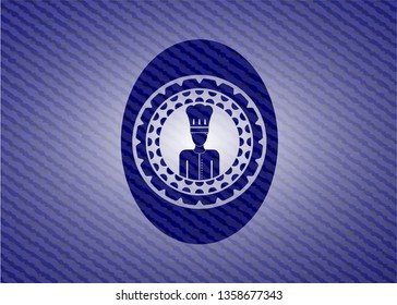 chef icon inside badge with denim background
