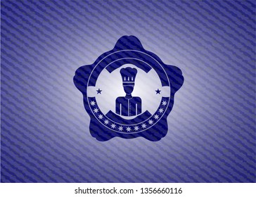chef icon inside badge with jean texture