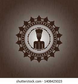 chef icon inside badge with wood background