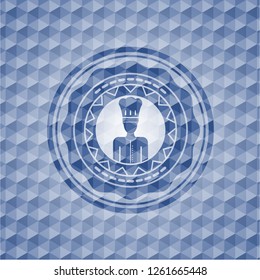 chef icon inside blue emblem or badge with abstract geometric pattern background.