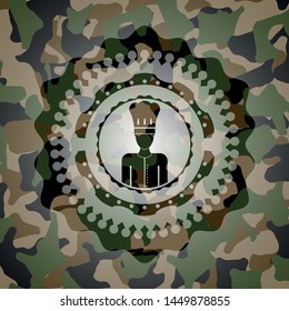 chef icon inside camouflaged emblem