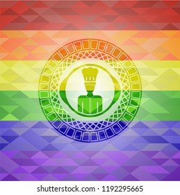 chef icon inside emblem on mosaic background with the colors of the LGBT flag
