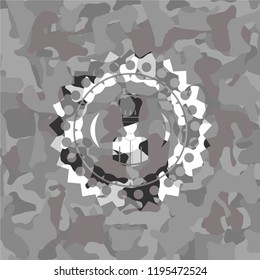 chef icon inside grey camouflage emblem