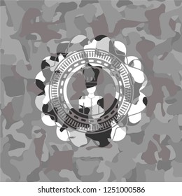 chef icon inside grey camouflage emblem