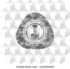 chef icon inside grey icon or emblem with geometric cube white background