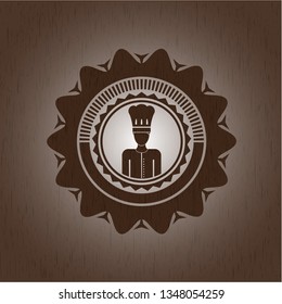 chef icon inside realistic wooden emblem