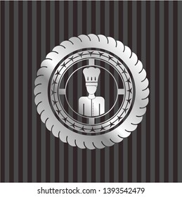 chef icon inside silvery badge or emblem