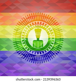 chef icon on mosaic background with the colors of the LGBT flag. 