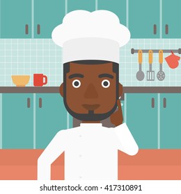 Chef pointing forefinger up.