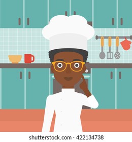 Chef pointing forefinger up.