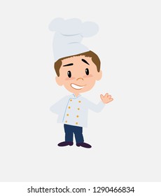 Chef showing something in positive attitude.