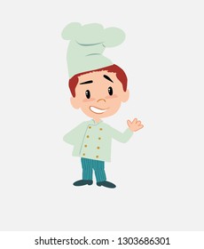 Chef showing something in positive attitude.