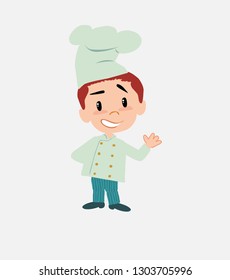 Chef showing something in positive attitude.