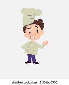 Chef showing something in positive attitude.