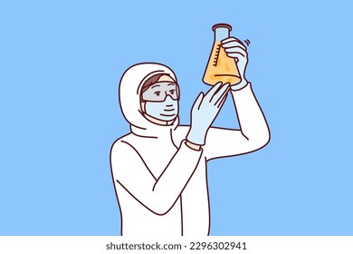 Chemist laboratory assistant holds test tube with reagent examining hazardous substance, dressed in chemical protection clothing. Female chemist examines contents of flask after synthesis