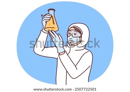 Chemist laboratory assistant holds test tube with reagent examining hazardous substance, dressed in chemical protection clothing. Female chemist examines contents of flask after synthesis
