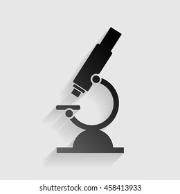 Chemistry microscope sign for laboratory. Black paper with shadow on gray background.