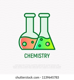 Chemistry thin line icon: two beakers with liquid. Modern vector illustration.